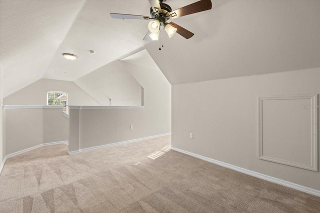 bonus room featuring ceiling fan, light colored carpet, and lofted ceiling