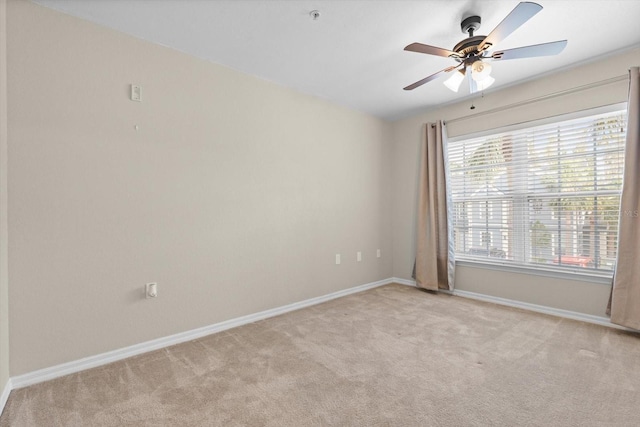 unfurnished room with light carpet and ceiling fan