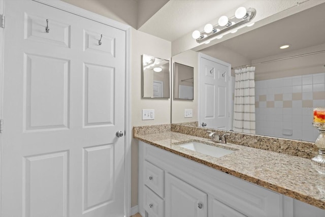 bathroom with vanity and walk in shower