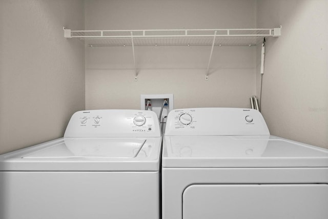 laundry room with washer and clothes dryer