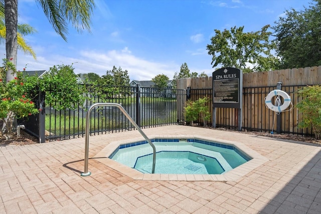 view of pool featuring a hot tub