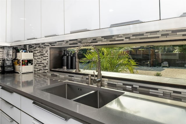 kitchen with sink and white cabinets