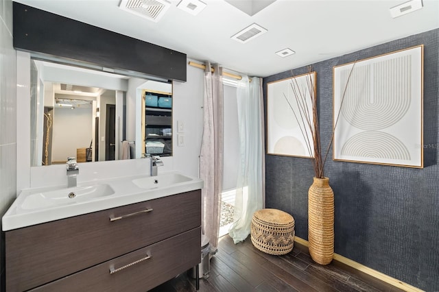 bathroom featuring vanity and wood-type flooring