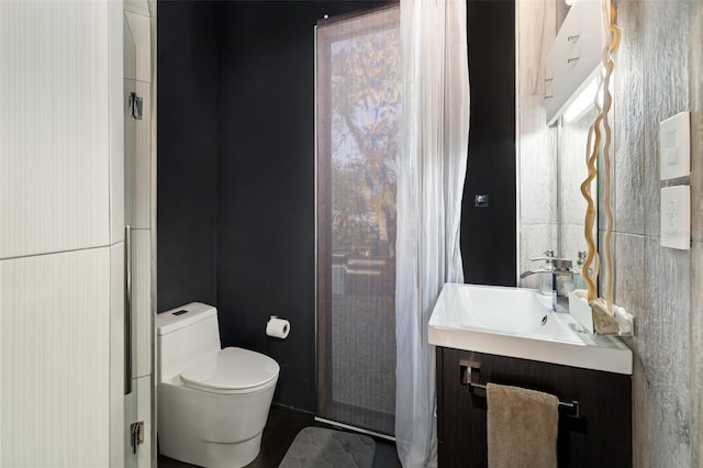 bathroom with vanity and toilet