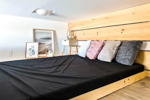 bedroom with wood-type flooring