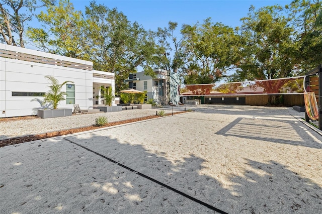 view of yard featuring volleyball court