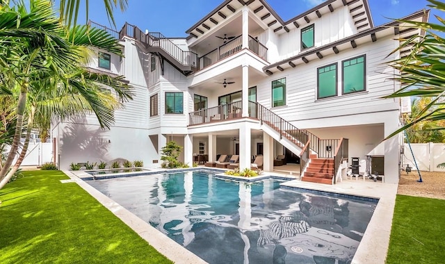 view of pool featuring a lawn, ceiling fan, and a patio area