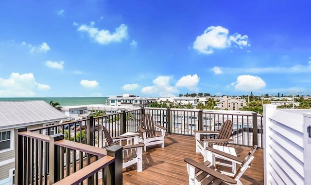 wooden deck featuring a water view