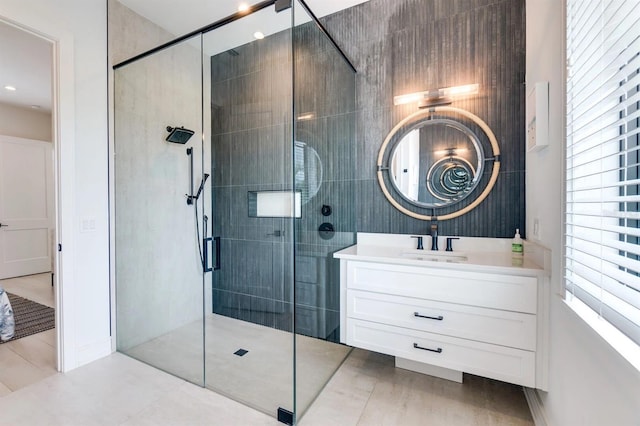 bathroom featuring vanity and an enclosed shower