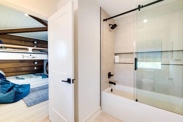 bathroom with wood-type flooring and shower / bath combination with glass door