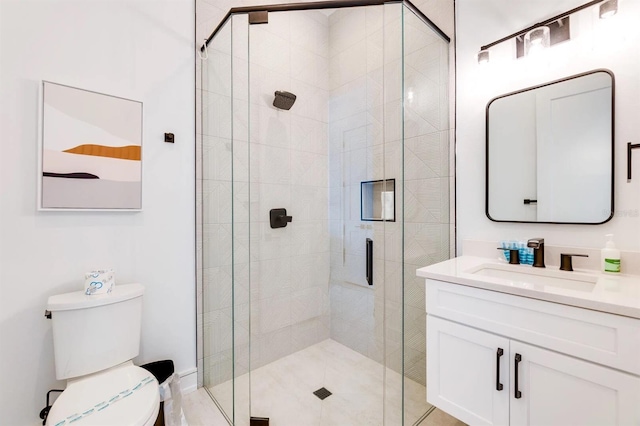 bathroom with vanity, toilet, and walk in shower