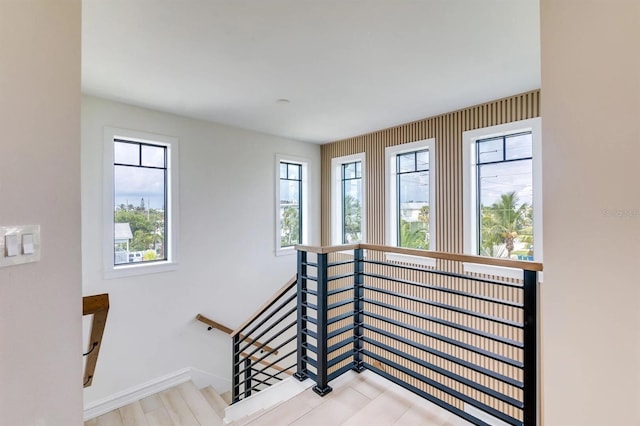 staircase featuring plenty of natural light