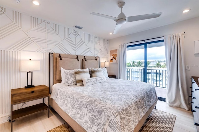 bedroom featuring access to outside, ceiling fan, and light hardwood / wood-style flooring