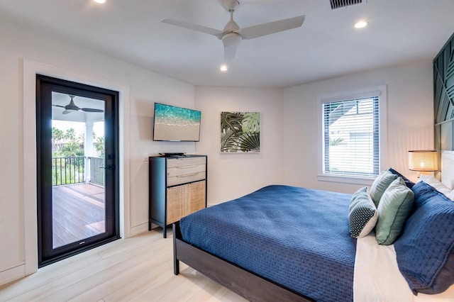 bedroom featuring multiple windows, ceiling fan, access to outside, and light hardwood / wood-style floors