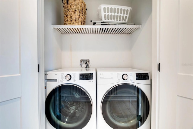 laundry area with independent washer and dryer