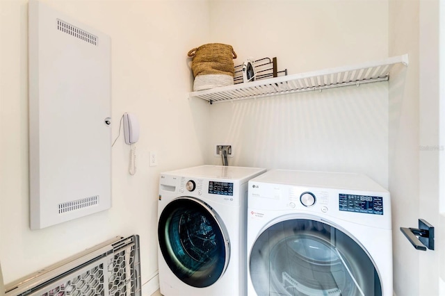 laundry area with washer and clothes dryer