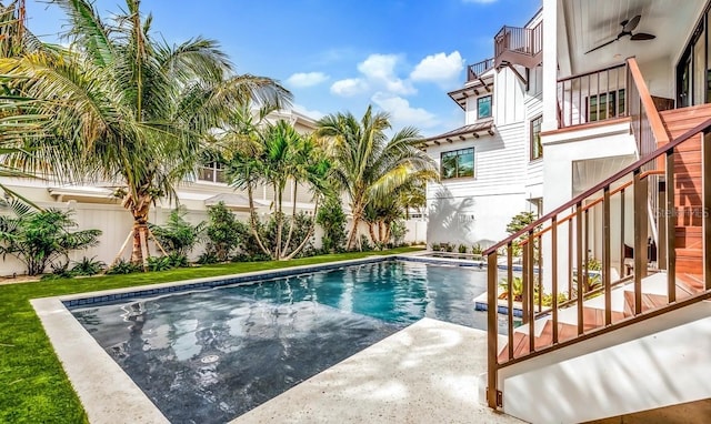 view of pool featuring a patio and ceiling fan