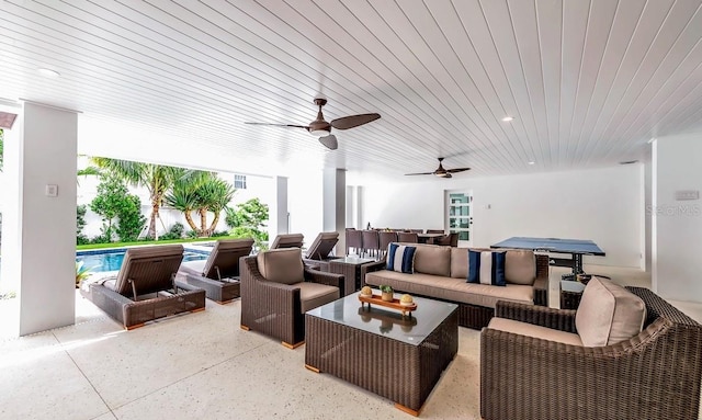 view of patio featuring a pool, outdoor lounge area, and ceiling fan