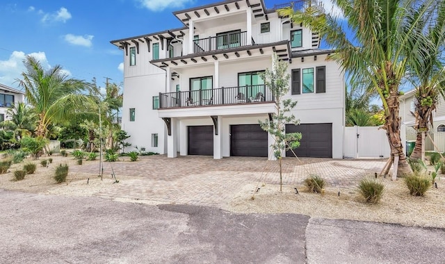 view of front of house with a balcony and a garage