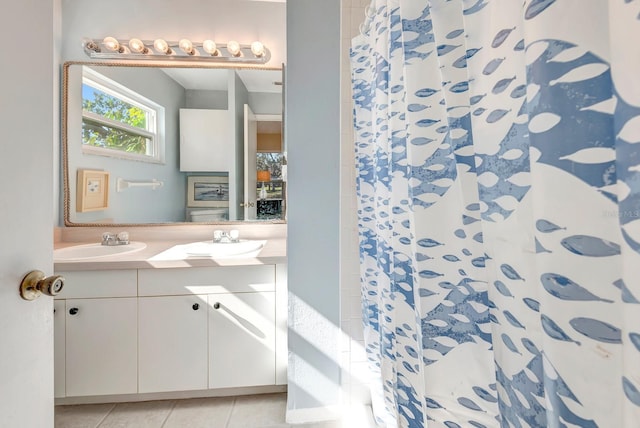 bathroom featuring vanity, tile patterned floors, and curtained shower