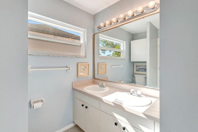 bathroom with vanity and toilet