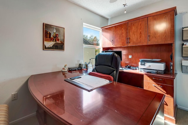 office space with a textured ceiling