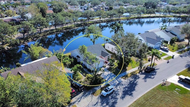 birds eye view of property with a water view