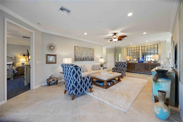 tiled living room with ceiling fan and ornamental molding