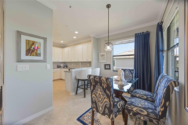 dining area with crown molding and light tile patterned floors