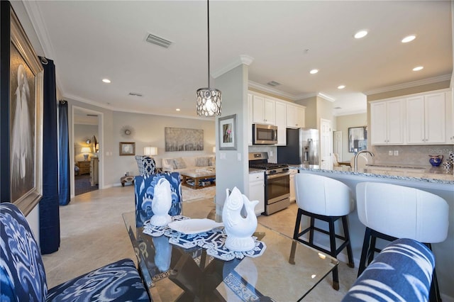 tiled dining room with ornamental molding