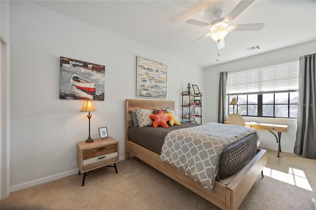 bedroom with ceiling fan and light colored carpet