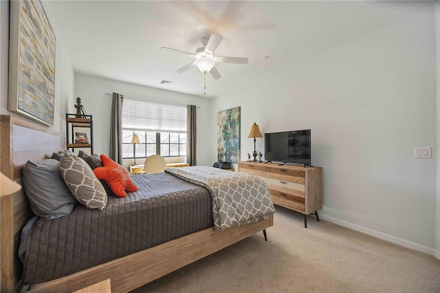 bedroom featuring ceiling fan and carpet