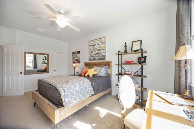 carpeted bedroom featuring ceiling fan