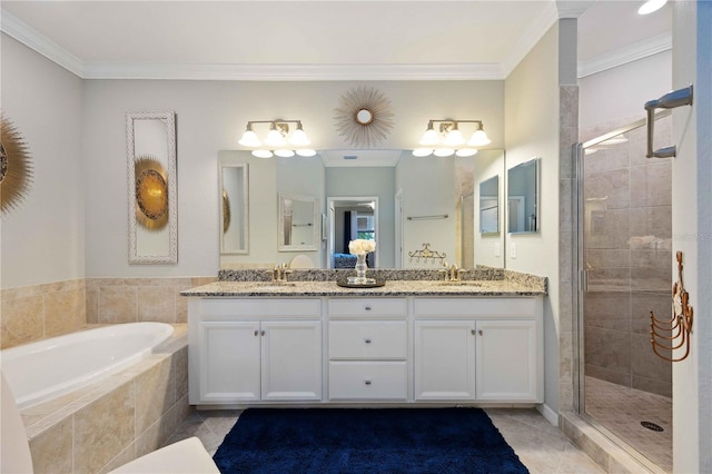 bathroom with tile patterned flooring, vanity, and ornamental molding