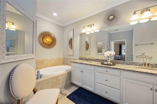 bathroom with tile patterned flooring, vanity, ornamental molding, and tiled tub