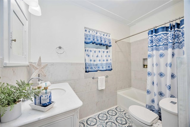 full bathroom featuring tile patterned flooring, tile walls, toilet, vanity, and shower / tub combo