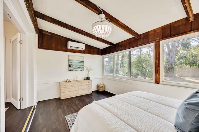 bedroom featuring dark hardwood / wood-style flooring, lofted ceiling with beams, a wall unit AC, and multiple windows