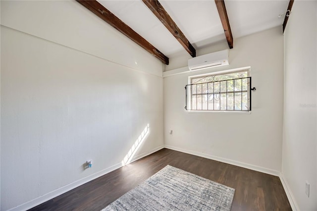 spare room featuring vaulted ceiling with beams, an AC wall unit, and dark wood-type flooring