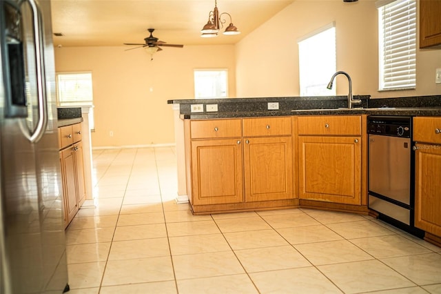 731 Cristelle Jean Dr, Ruskin, FL 33570 - kitchen featuring light tile patterned floors, a sink, a peninsula, appliances with stainless steel finishes, and brown cabinetry