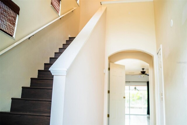 731 Cristelle Jean Dr, Ruskin, FL 33570 - stairs with arched walkways and ceiling fan