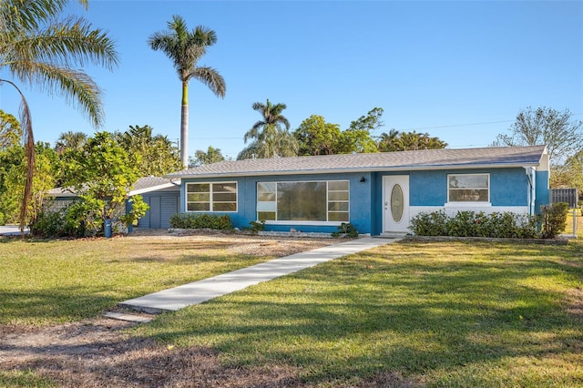 ranch-style house featuring a front lawn