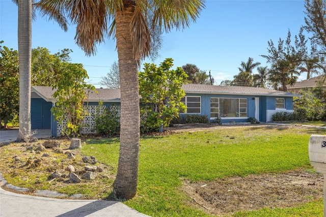 single story home featuring a front yard