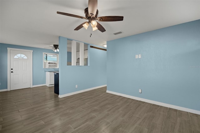 unfurnished living room featuring ceiling fan, cooling unit, and hardwood / wood-style floors