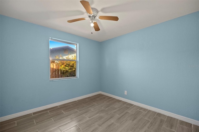 unfurnished room with ceiling fan and hardwood / wood-style floors