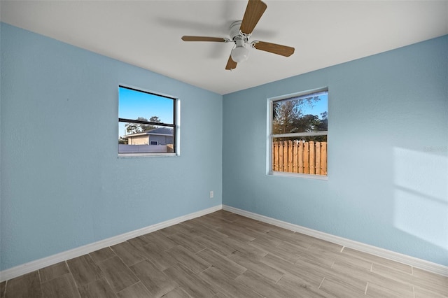 unfurnished room with ceiling fan