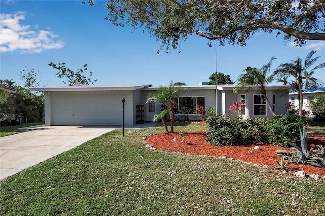 ranch-style house with a front yard and a garage