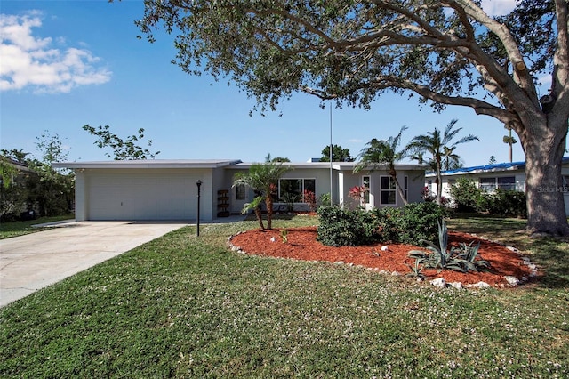 ranch-style house with a front yard and a garage