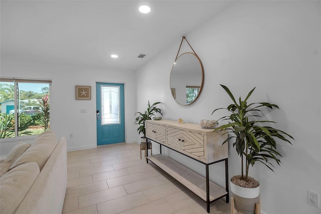 foyer entrance featuring light tile patterned flooring