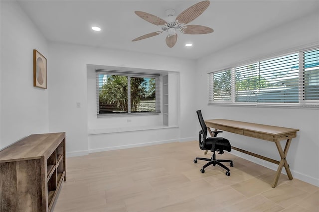 office with a wealth of natural light, ceiling fan, and light tile patterned floors