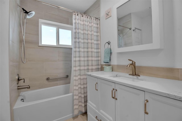 bathroom featuring vanity and shower / tub combo